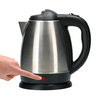 Electric stainless steel kettle with black handle and base, a hand touching the base