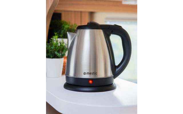 Electric stainless steel kettle on white countertop