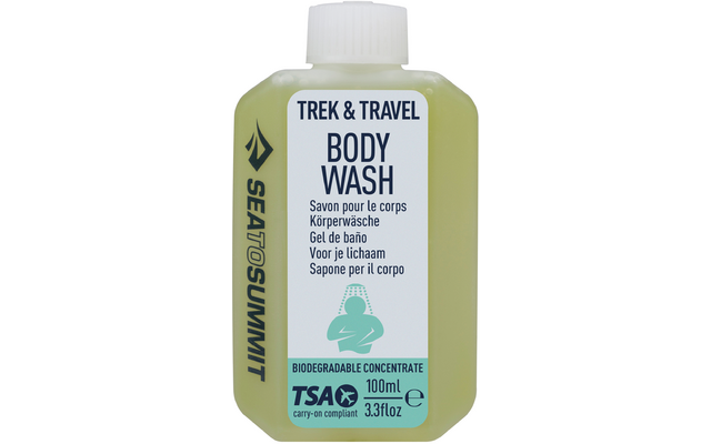 Weiße Flasche mit grünem Etikett und Aufschrift Trek & Travel Body Wash