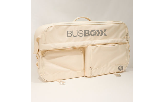 Sac beige souple avec poignée, deux poches avant zippées et inscription grise "BUSBOXX" sur fond neutre