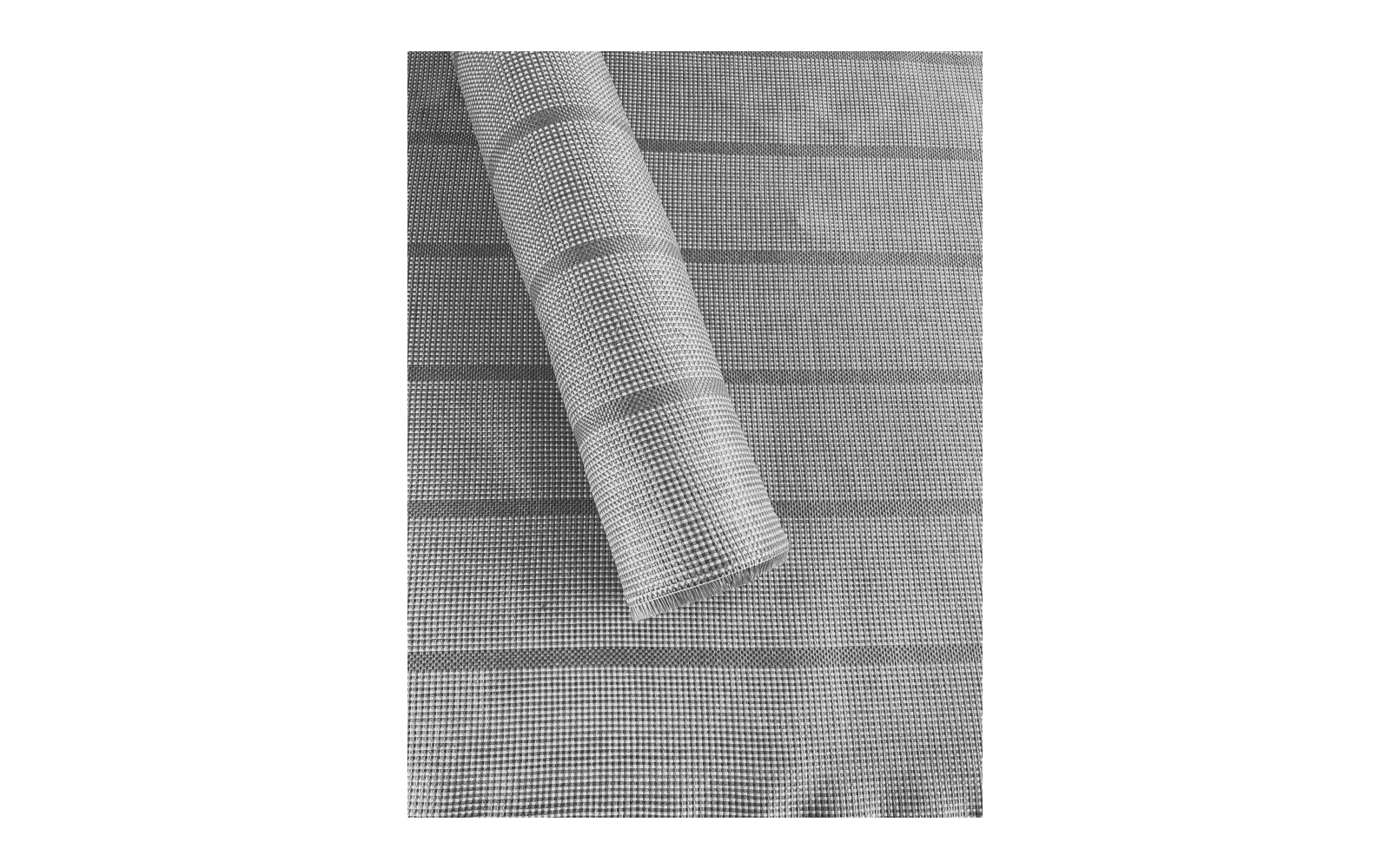 Gros plan d'un tissu roulé avec un motif à carreaux fins