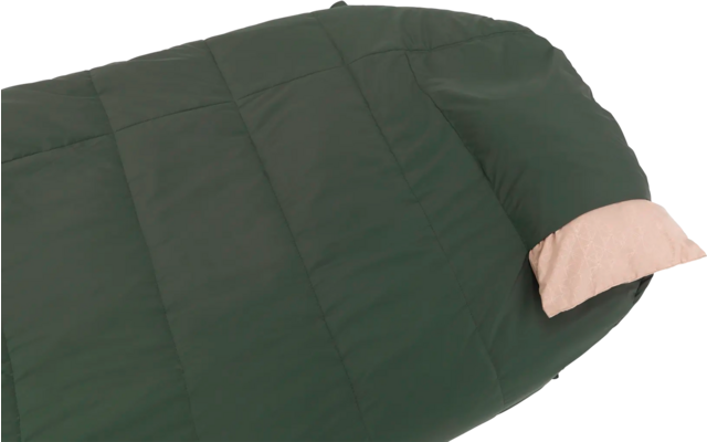 Donkergroene slaapzak met een lichtroze kussen