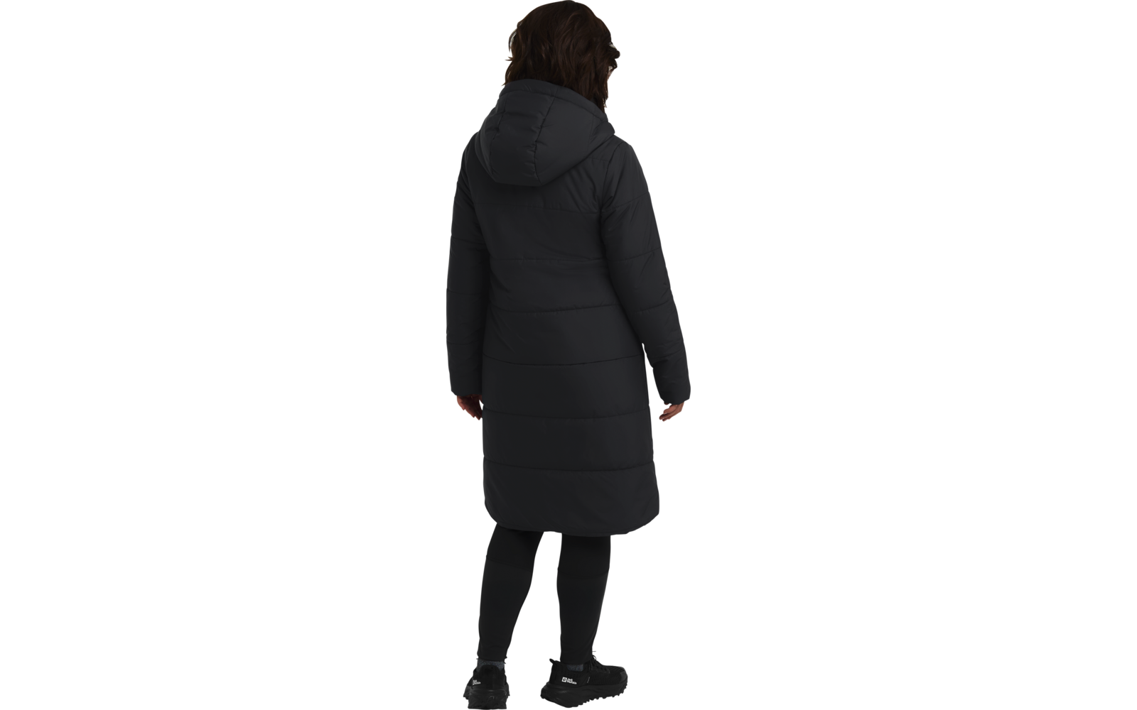 Person von hinten in einem langen, schwarzen Mantel und schwarzer Hose