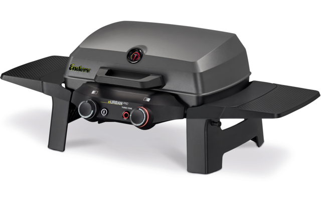 Schwarz-grauer Tischgrill mit geschlossenem Deckel, zwei Drehreglern mit roten Akzenten, zwei seitlichen Ablagen und vier kurzen Beinen