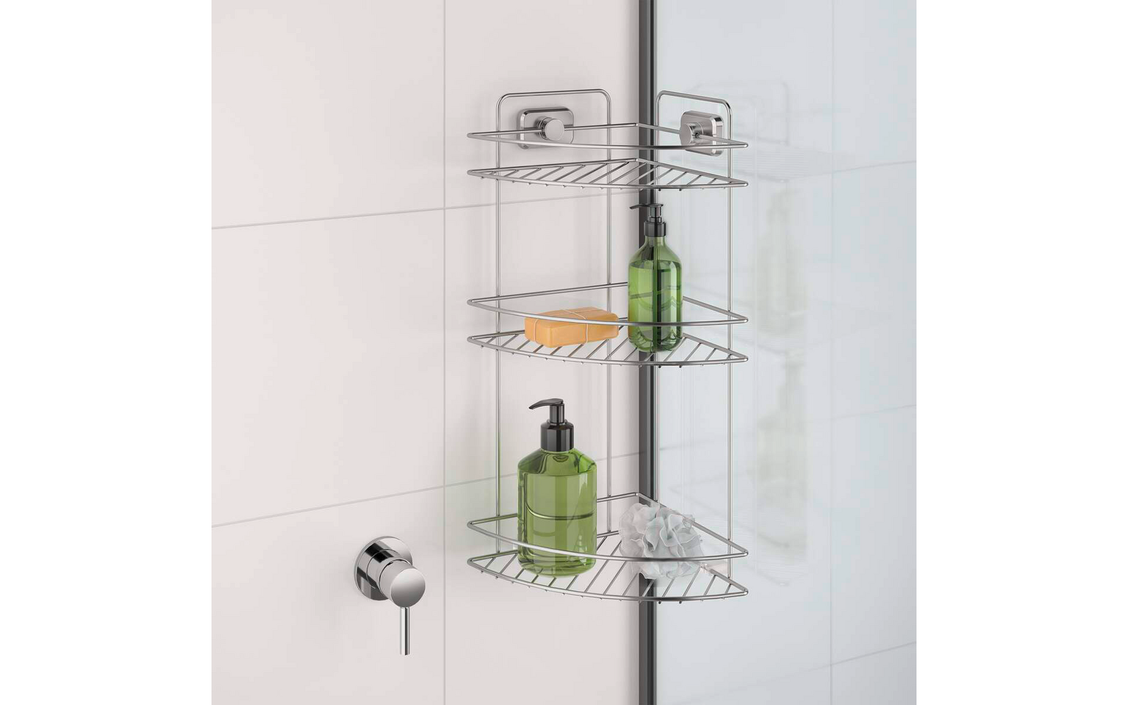 Three-tier metal corner shelf in a shower; on the shelves a yellow bar of soap, a green bottle, a green pump bottle, and a white cloth; left a shower control knob, right a glass door with black frame