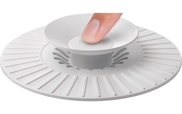 Hand mit ausgestrecktem Zeigefinger berührt rundes weißes Gerät auf runder, gerillter Basis auf hellem Untergrund