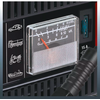 Close-up of a black device panel with a transparent analog meter with red needle and scale, ribbed metal area below. Left white pictograms: car, truck, motorcycle, boat. Right a connector with blue interior and the label "15 A". Front a thick black cable with plug