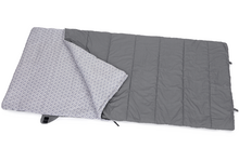 Opened gray sleeping bag with dotted lining on white background