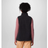 Person von hinten, trägt schwarzen dünnen Pullover und beige Hose
