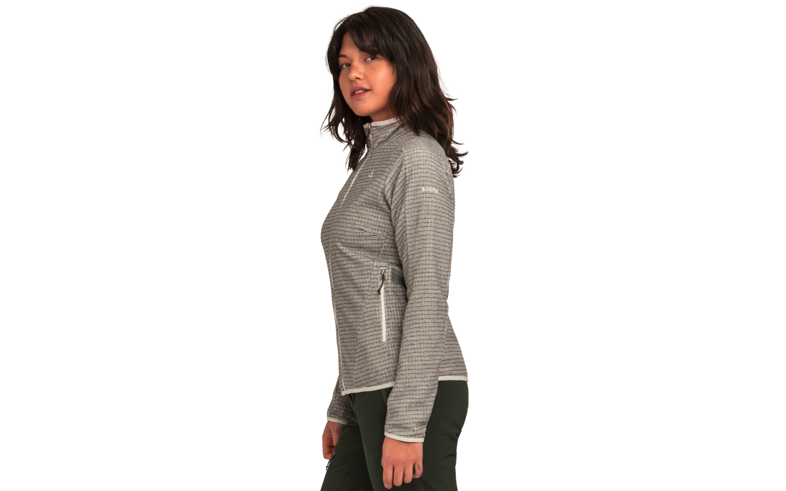 Frau mit grauem Blazer und schwarzer Hose, seitlich stehend