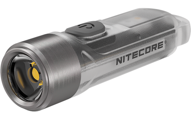 Kleines transparentes Gerät mit rundem Metallkopf, sichtbarer LED, grauem Gummiknopf oben und Schriftzug "NITECORE" an der Seite