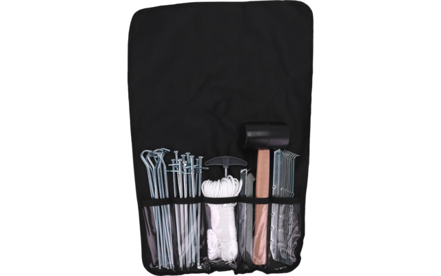 Black fabric pouch with five compartments; left: long curved metal stakes, next: straight metal nails, center: coiled white rope, right: black rubber mallet with wooden handle, beside it curved metal hooks and flat metal plates
