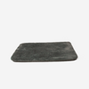 Flache dunkelgraue rechteckige Stoffmatte mit abgerundeten Ecken auf weißem Hintergrund