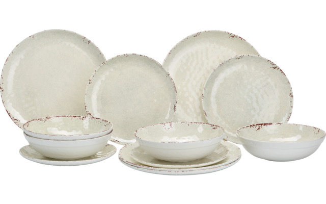 Several cream-colored ceramic plates and bowls with uneven brown rims on a white surface