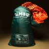 Dark green stuff sack with white "TAMBU connect to nature" logo and white product label at the bottom; orange patterned fabric protrudes from the opening; dark background