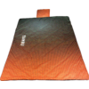 Rectangular orange and black padded mat with small attached headrest, dotted pattern and white lettering on the left