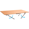 Rectangular light wooden tabletop with two unfolded gray metal legs and blue arrows showing the legs' movement direction