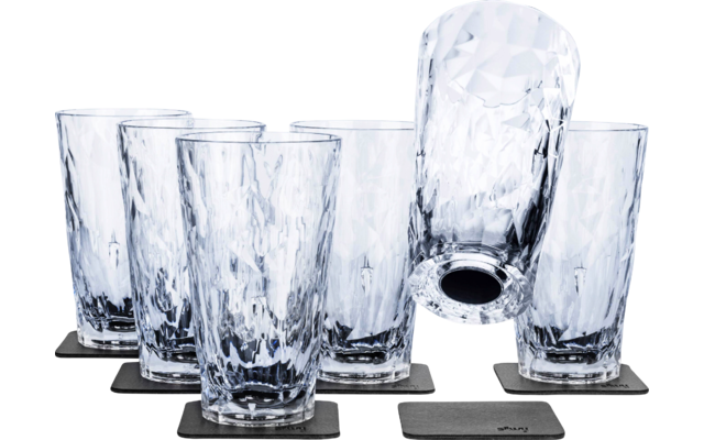 Six textured drinking glasses, one upside down, each on a square black coaster, white background