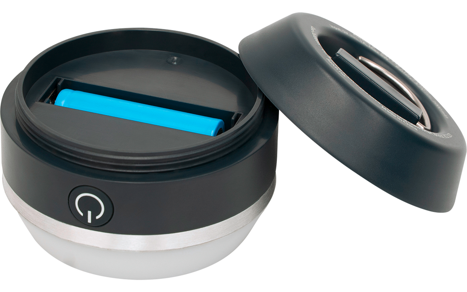 Rundes schwarzes Gerät mit abnehmbarem Deckel, silbernem Rand, innen ein blaues rechteckiges Element und Einschaltsymbol auf der Vorderseite