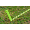 Green plastic stake with two neon-green cords, pushed into grass