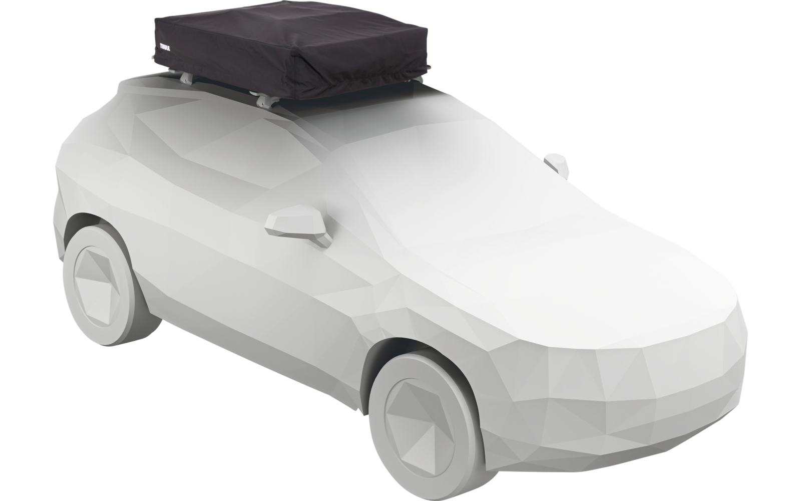 Voiture blanche facettée avec un coffre de toit noir fixé sur un porte-bagages de toit