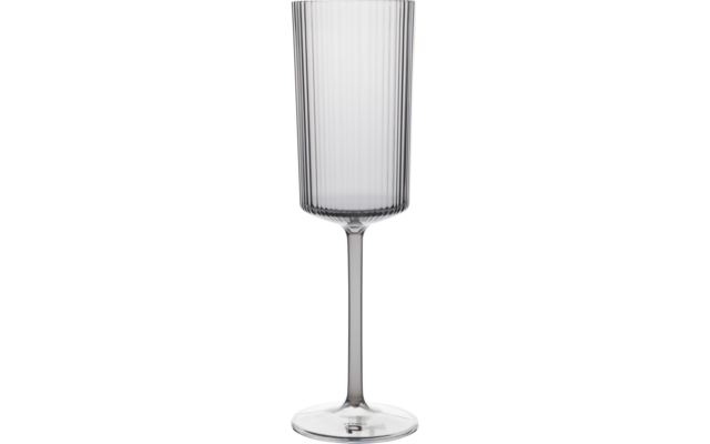 Transparent tall glass with a narrow bowl, vertical ridges, a long stem and a round base