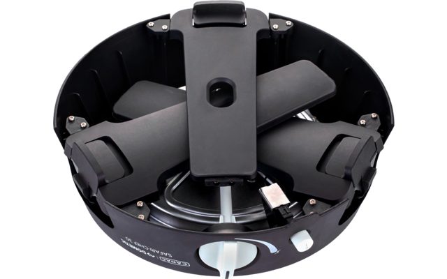 Boîtier circulaire noir avec bras d'hélice repliés, prise USB argentée visible et connecteur blanc