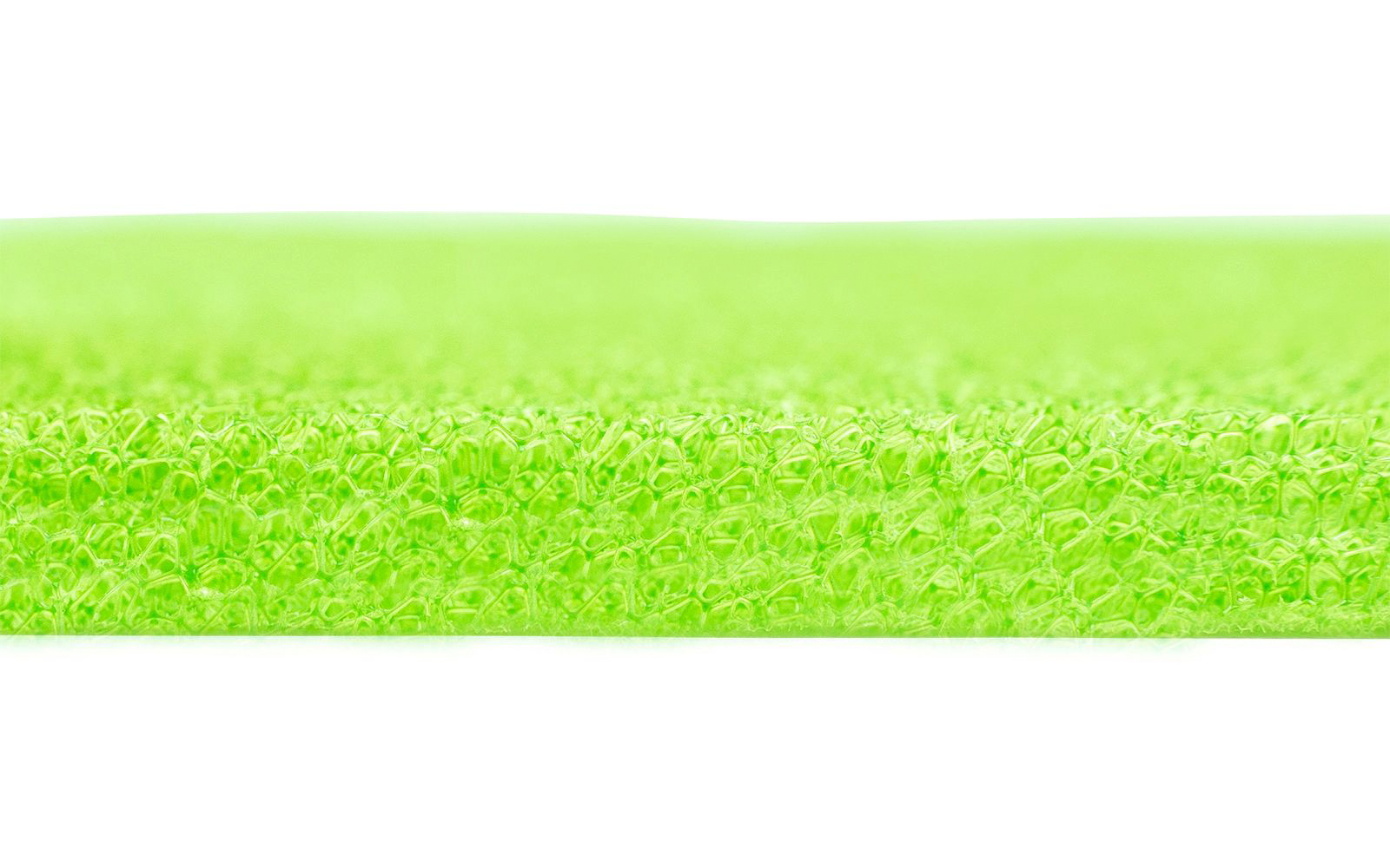 Primo piano di una superficie strutturata verde neon con fibre sottili e dense; inquadratura orizzontale