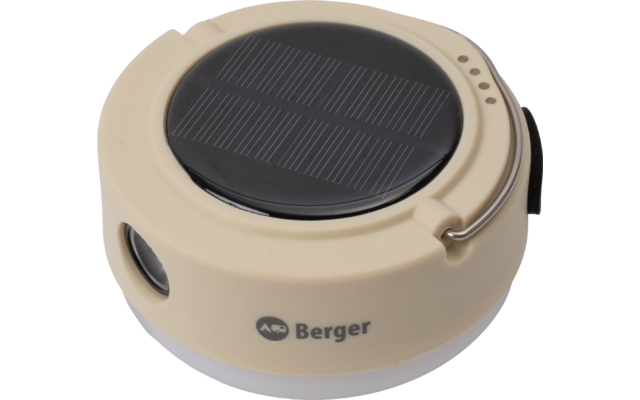 Dispositivo redondo beige con panel solar circular negro en la parte superior, cuatro pequeñas aberturas redondas en el borde, lente redonda en el lateral, gancho metálico, lazo de tela negro, parte inferior blanca translúcida y texto Berger con logo en el lateral