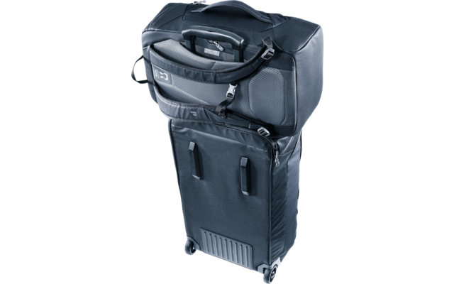 Dunkelblauer Rollkoffer mit zwei Rollen und einer oben befestigten Reisetasche mit Reißverschlüssen, Tragegriff und Schnallen