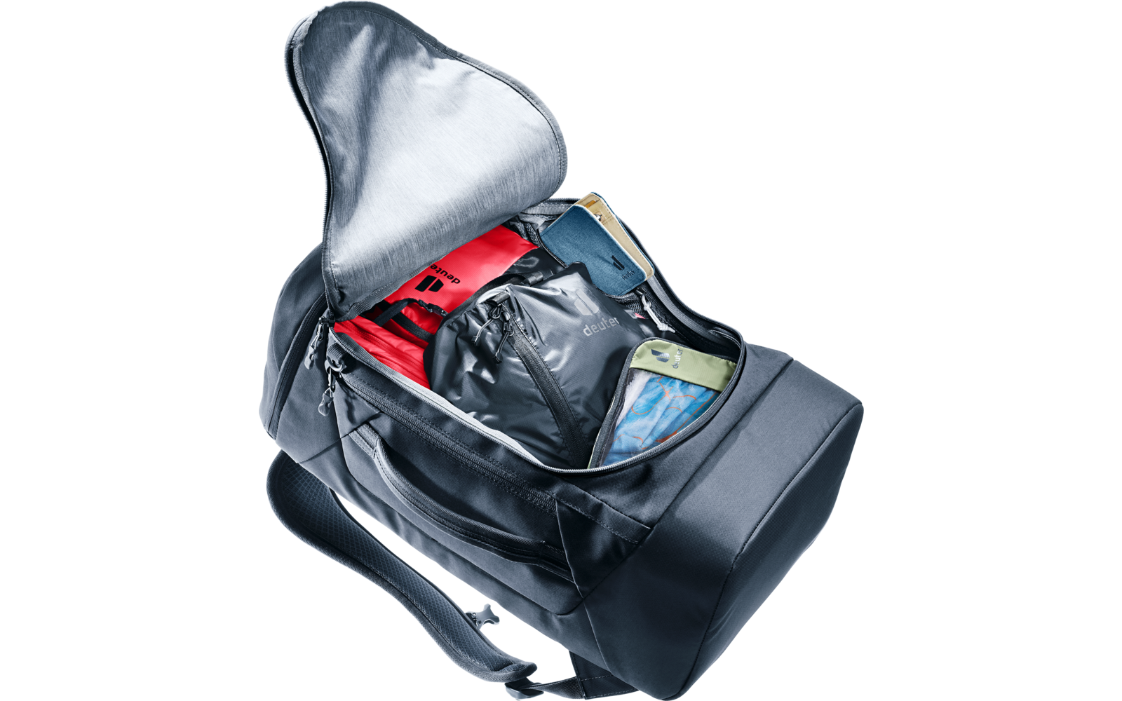 Offene dunkelgraue Reisetasche mit rotem Etui, schwarzem Beutel, grünem Etui und blau gemustertem Tuch im Inneren