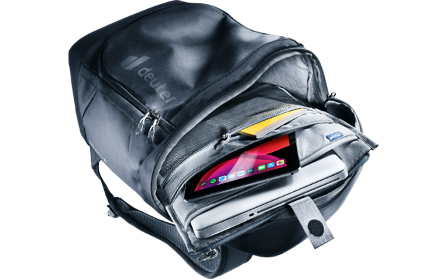 Offener dunkelgrauer Rucksack mit Laptop, Tablet mit farbigem Bildschirm und gelbem Notizbuch