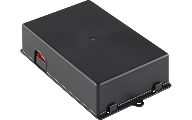 Boîtier rectangulaire en plastique noir avec une encoche ronde visible sur le dessus, un élément rouge sur le côté et une patte de fixation à l'avant sur fond blanc