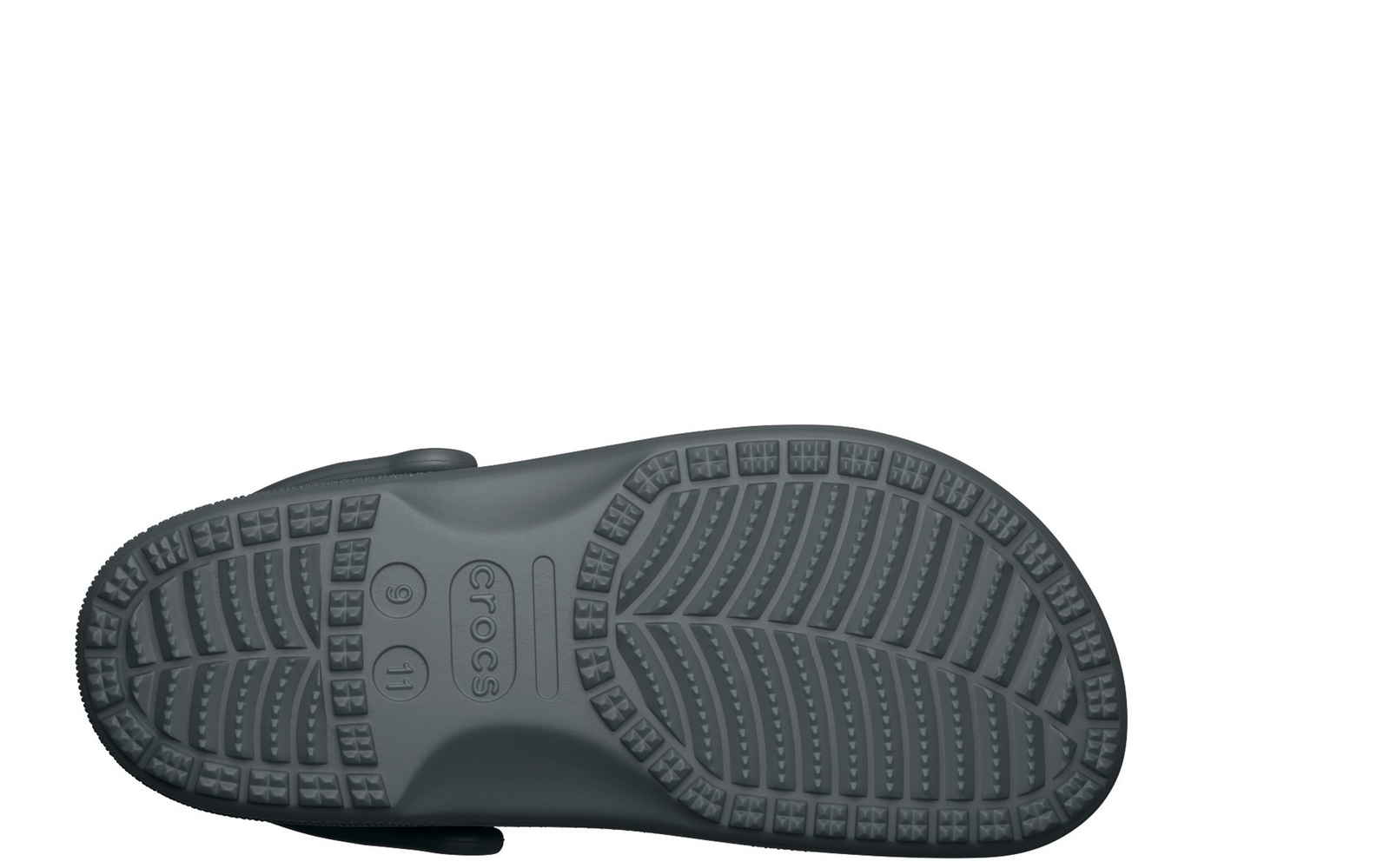 Unterseite eines grauen Clogs mit profiliertem Sohlenmuster und sichtbarem Riemenansatz