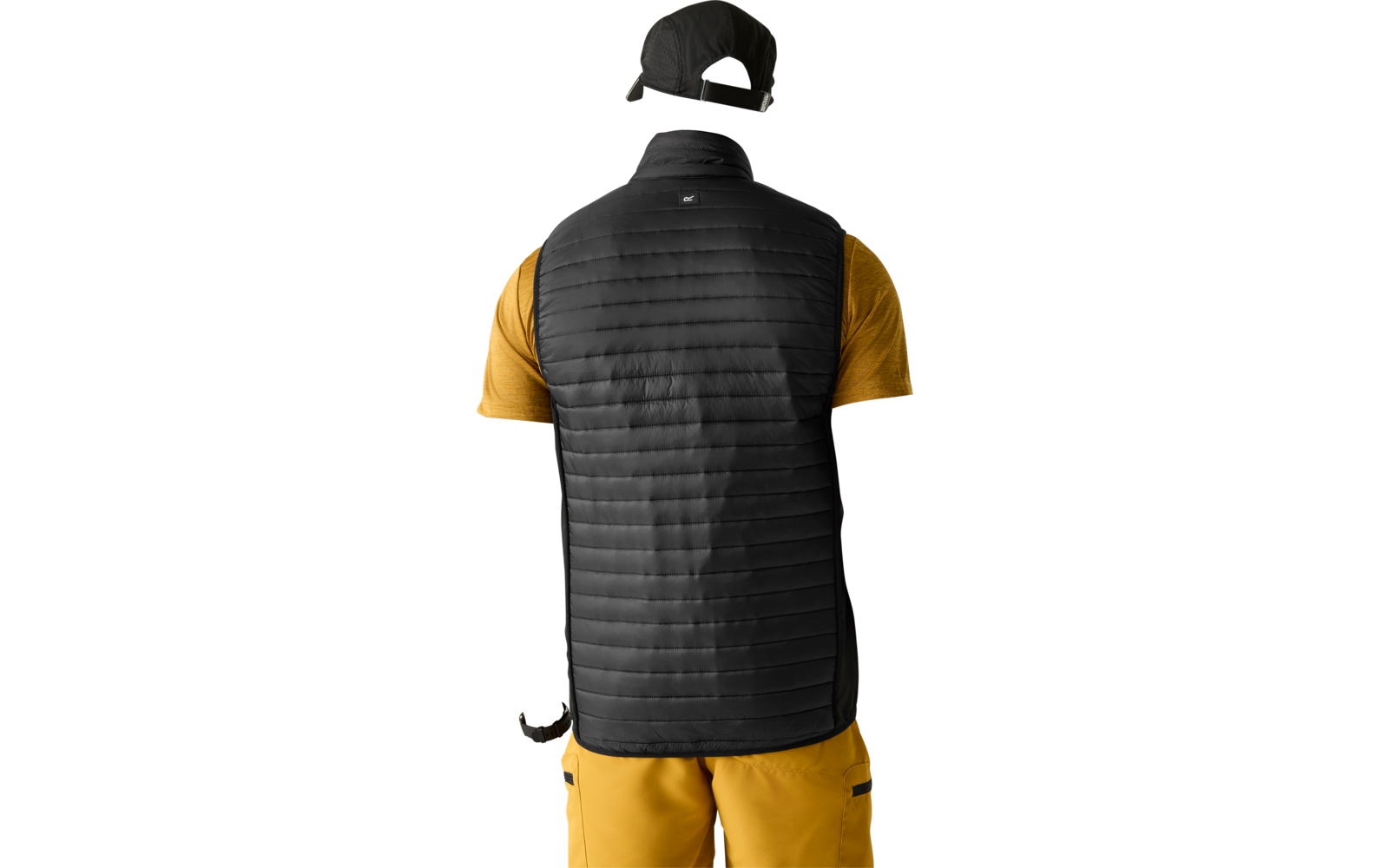 Person shown from behind wearing a black quilted vest, yellow short-sleeve shirt, yellow pants, black cap and wristwatch, plain light background