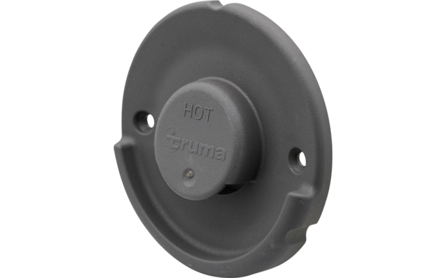 Perilla redonda gris en el centro con texto en relieve 'HOT' y 'truma' sobre una placa de montaje circular con dos orificios para tornillos