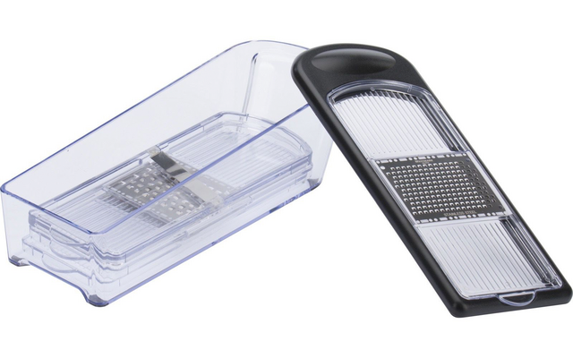 Boîte rectangulaire en plastique transparente avec inserts râpes métalliques empilés ; à côté, un cadre en plastique noir avec deux surfaces râpeuses en métal