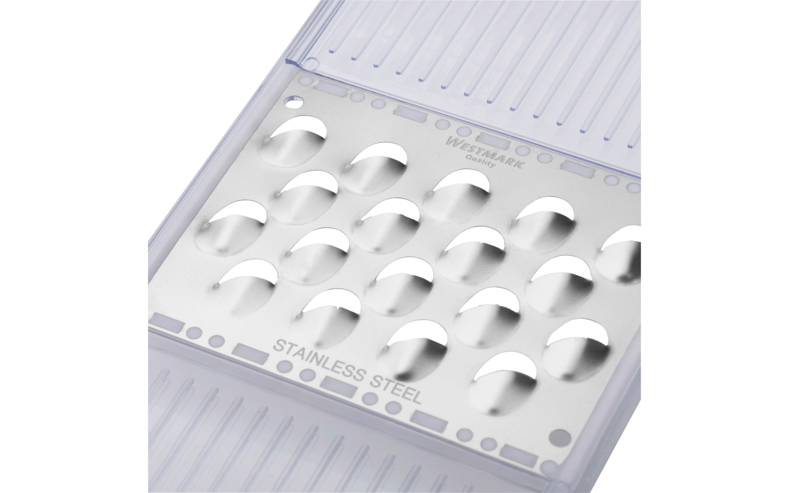 Râpe en acier inoxydable avec trous ronds sur un récipient en plastique transparent rainuré, inscription 'STAINLESS STEEL' visible