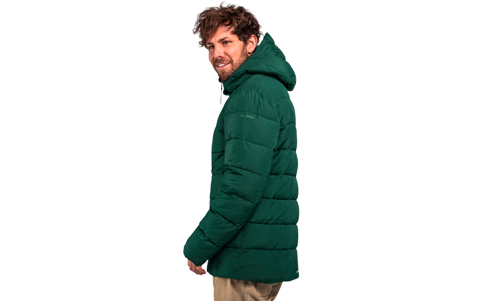 Man met groene donsjas met kap die naar links kijkt