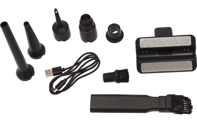 Plusieurs embouts noirs coniques et cylindriques, un câble USB noir, une petite brosse à poils, une pièce rectangulaire avec deux surfaces métalliques en maille et un long embout plat avec extrémité brosse