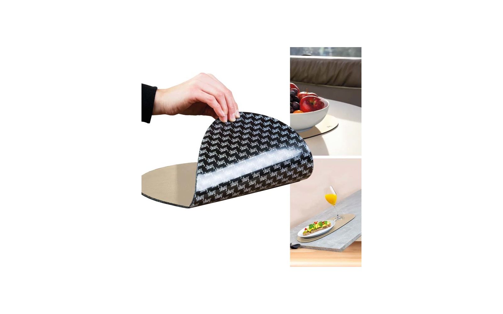 Hand löst ein schwarzes Blatt mit wiederholter weißer Schrift von einer ovalen silbernen Platte; daneben eine Schale mit roten Äpfeln auf einem Tisch sowie ein Teller mit Essen und ein Glas Orangensaft