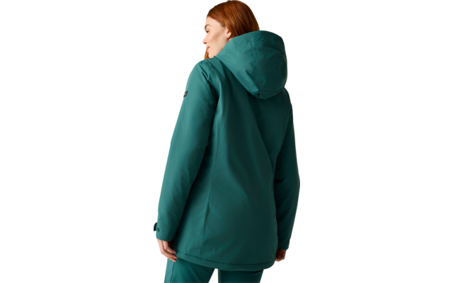 Person with red hair seen from the back, wearing a teal hooded jacket and matching pants against a light beige background
