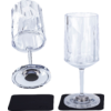 Two faceted clear-glass wine glasses on a white background, each on a black square coaster; left an upside-down glass with its base facing forward, right a glass standing upright