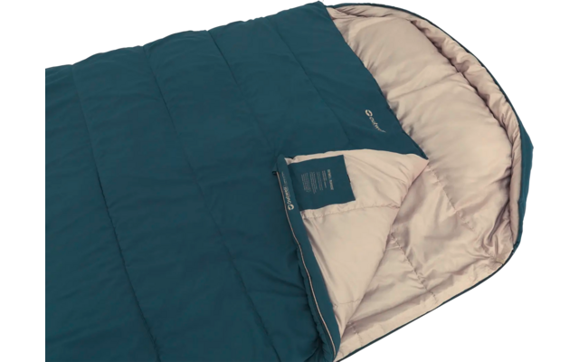 Blau-grüner Schlafsack mit hellbeiger Innenfüllung, teilweise aufgerollt