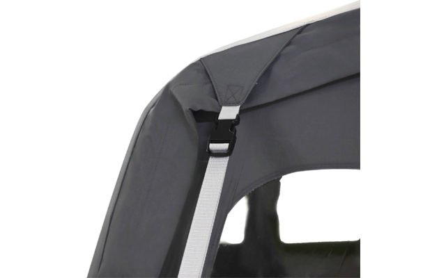 Close-up of a gray fabric edge with a white strap, a black plastic buckle, and a transparent window