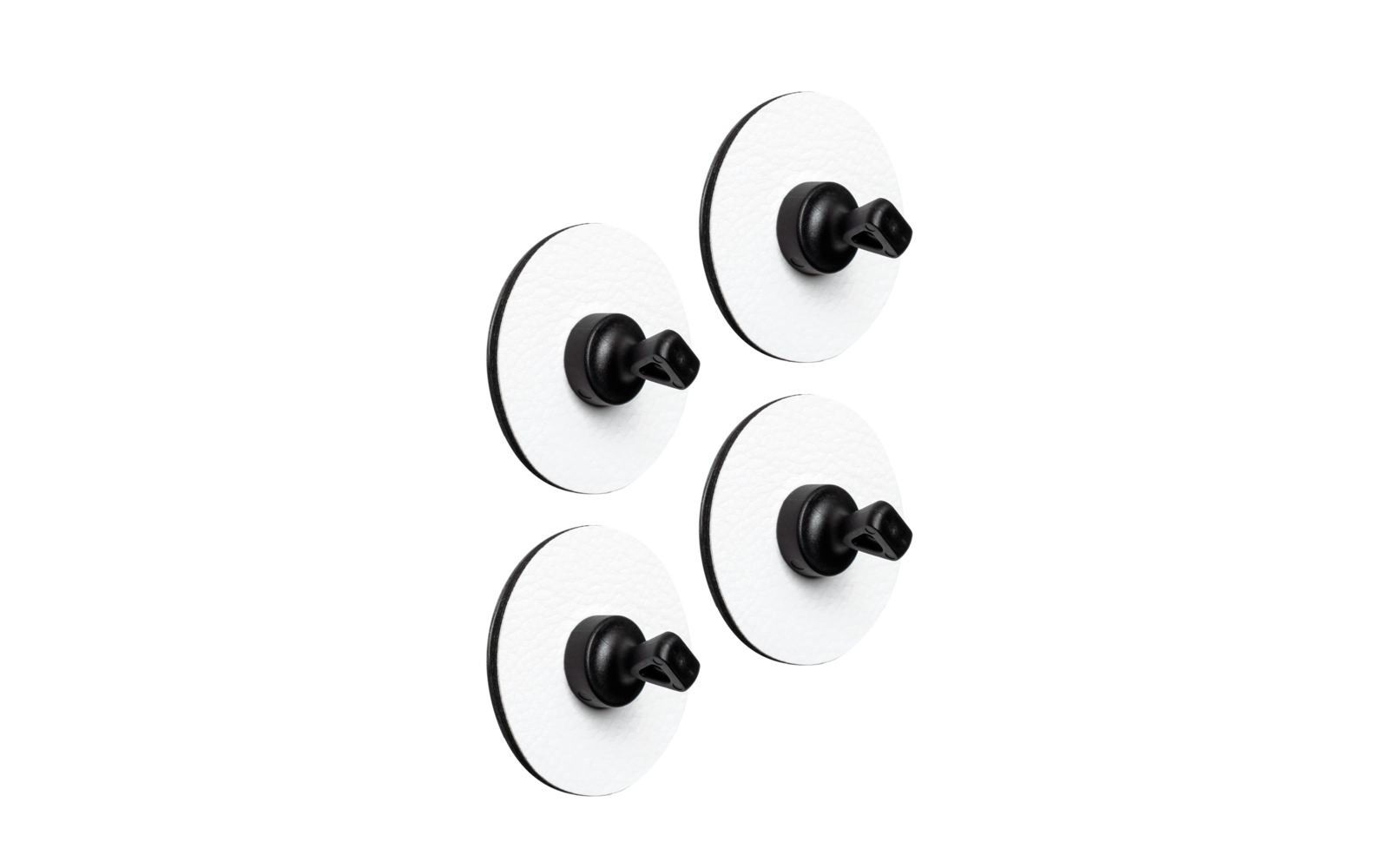 Four black hooks with white round suction cups on a white surface