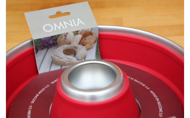 Red baking mold with a small recipe booklet