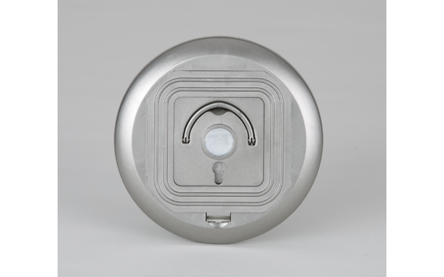 Dispositif rond argenté avec un capteur et un indicateur lumineux au centre