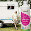 Man standing in front of a caravan, a bottle of dishwasher additive in the foreground