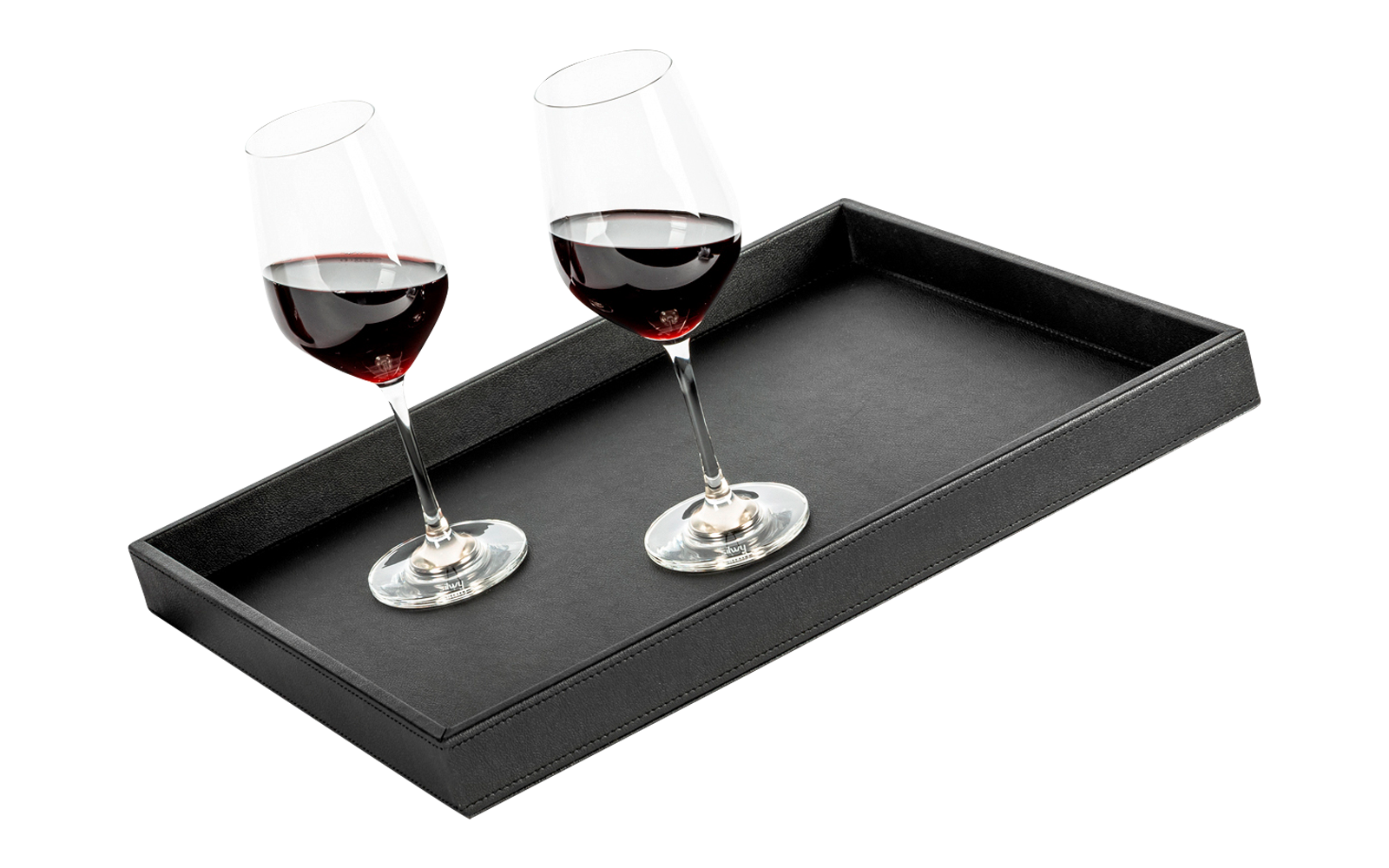 Two red wine glasses on a black tray